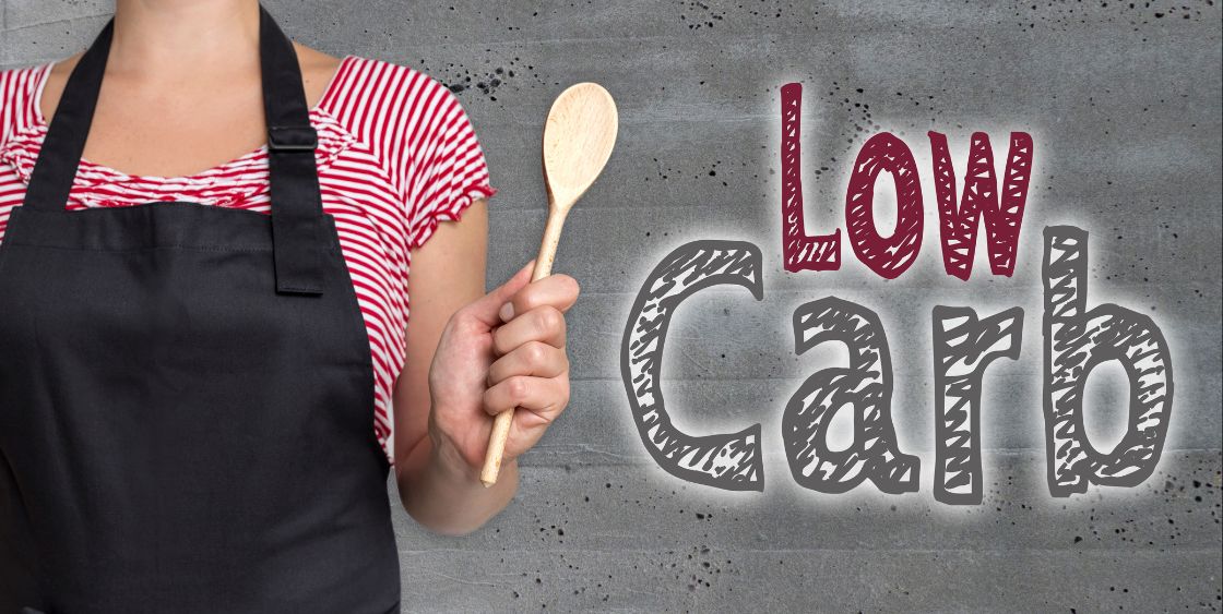 Women in apron with the words low carb next to it 