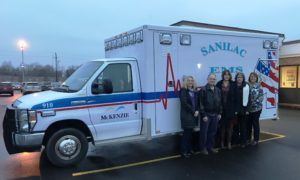 McKenzie Foundation leaders with the new ambulance